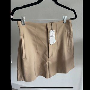 Stradivarius high waisted nude dress shorts - size US 8